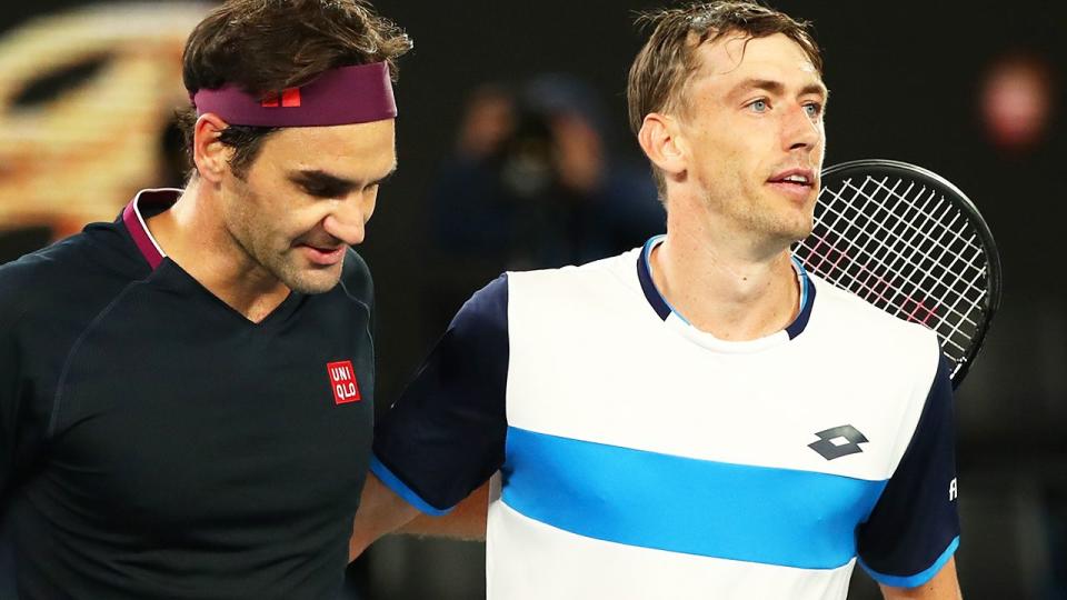 John Millman and Roger Federer, pictured here after their match at the Australian Open in January.