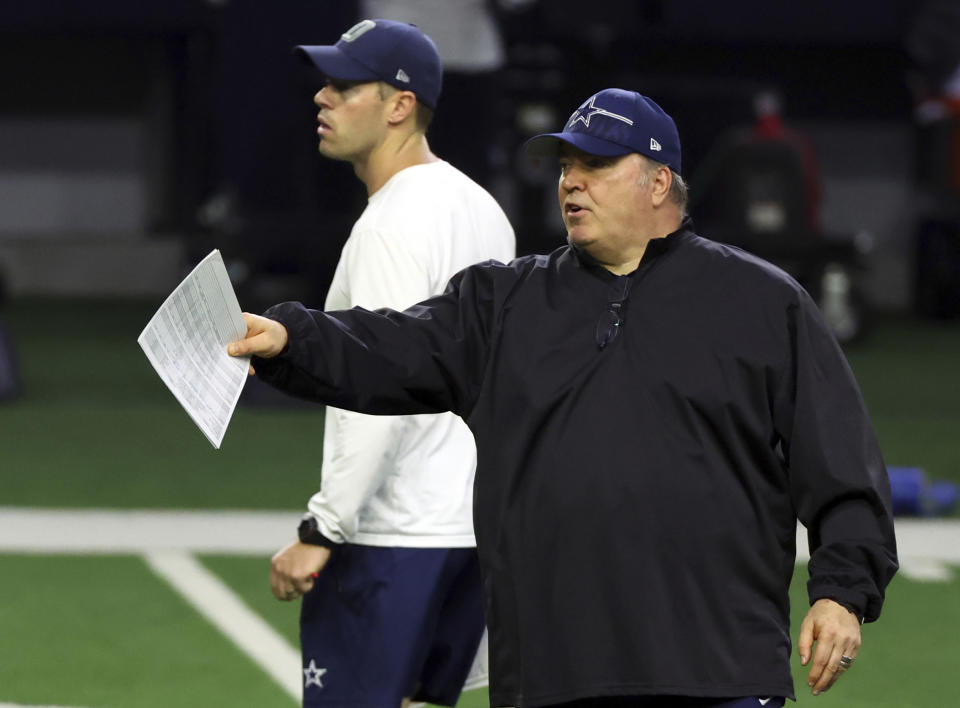 Dallas Cowboys quarterback coach Scott Tolzien, left, and head coach Mike McCarthy watch during an NFL football practice, Tuesday, June 6, 2023, in Frisco, Texas. (AP Photo/Richard W. Rodriguez)