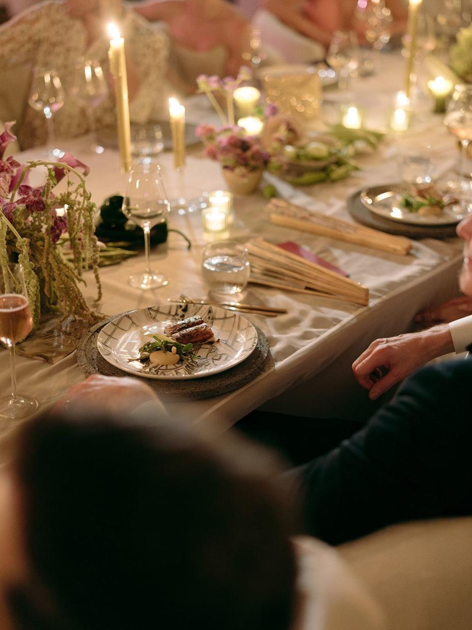 a table with plates and glasses of wine on it