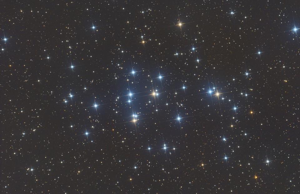A cluster of blue-white stars in space.