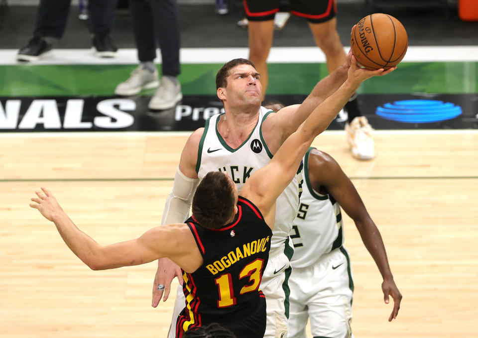 MILWAUKEE, WISCONSIN - JULY 01: Brook Lopez #11 of the Milwaukee Bucks blocks a  during the second half in Game Five of the Eastern Conference Finals at Fiserv Forum on July 01, 2021 in Milwaukee, Wisconsin. NOTE TO USER: User expressly acknowledges and agrees that, by downloading and or using this photograph, User is consenting to the terms and conditions of the Getty Images License Agreement. (Photo by Stacy Revere/Getty Images)