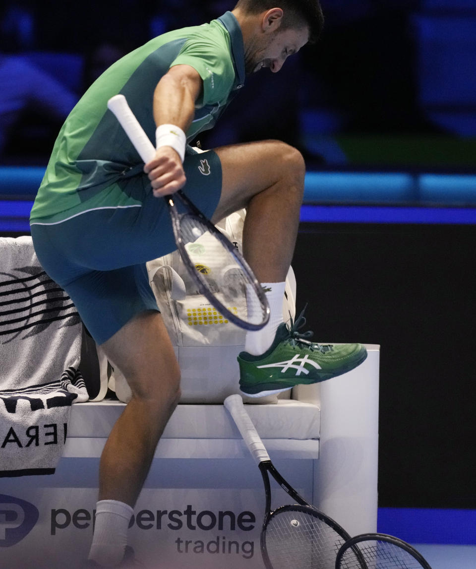 Serbia's Novak Djokovic reacts during the singles tennis match against Denmark's Holger Rune, of the ATP World Tour Finals at the Pala Alpitour, in Turin, Italy, Sunday, Nov. 12, 2023. (AP Photo/Antonio Calanni)