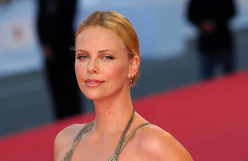 Charlize Theron has complained about how she was dressed by directors in her early film roles credit:Bang Showbiz