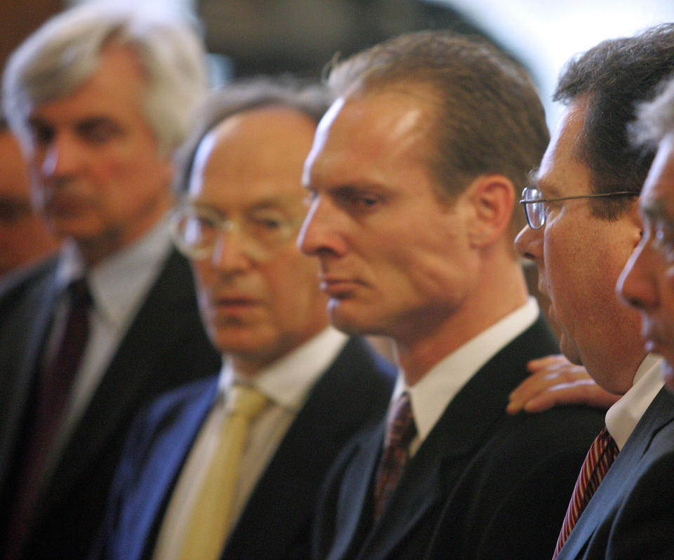 Dan Biechele, center, at his sentencing. The tour manager for the rock band Great White  pleaded guilty to 100 counts of misdemeanor manslaughter and was sentenced to four years in prison. / Credit: AP