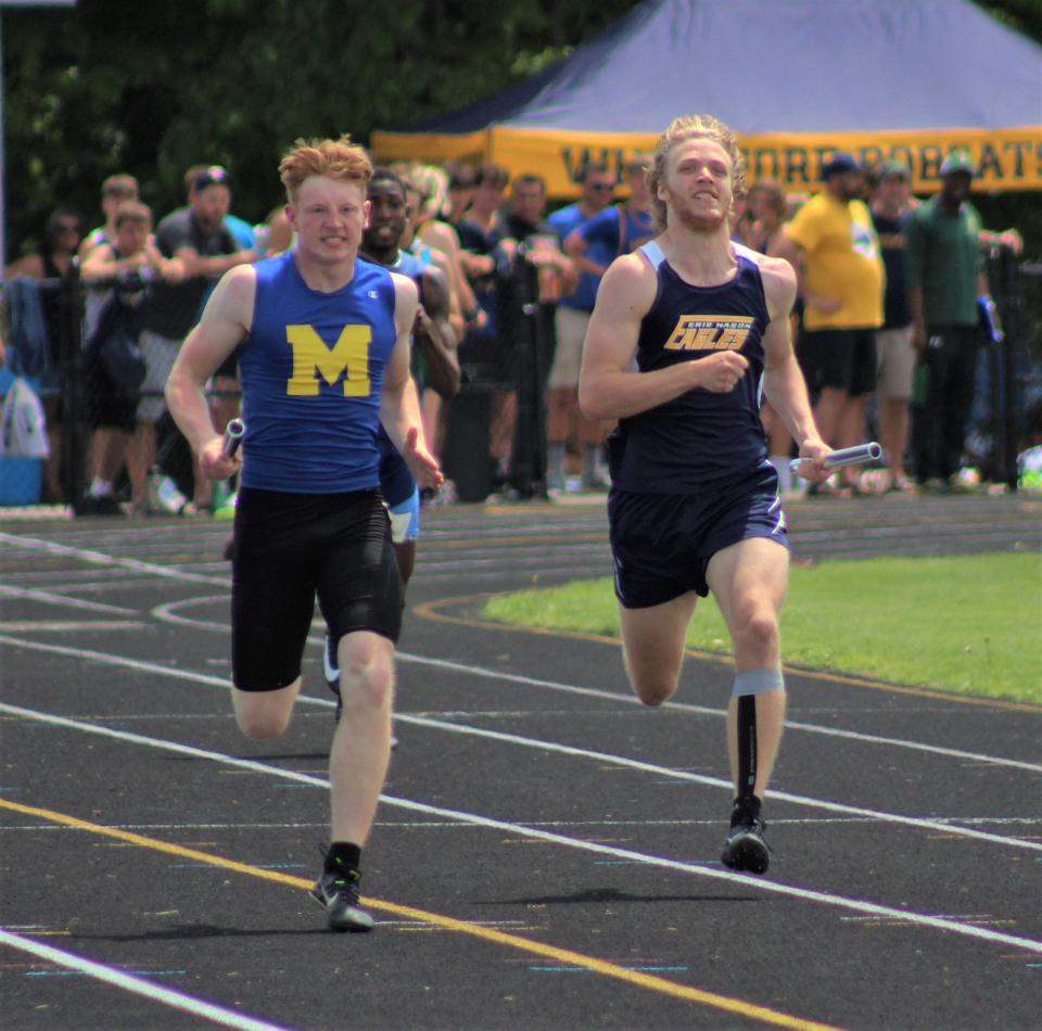 Cooper Kinsey of Erie Mason (right) runs lockstep with Adrian Madison's Sean DeLeon down the final stretch of the 800 during a Regional meet at Whiteford.