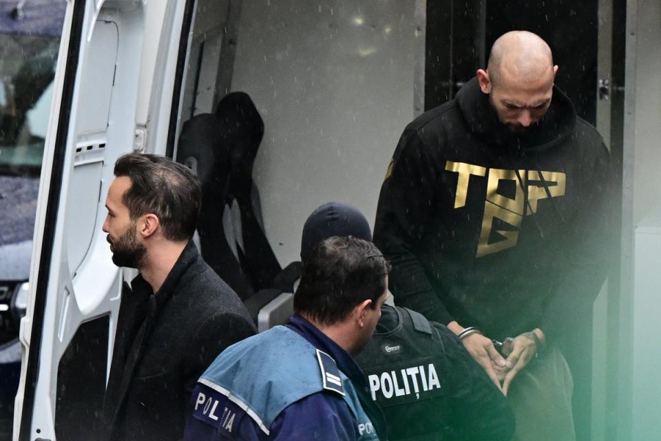 Andrew Tate and his brother being escorted into the court hearing (Getty)