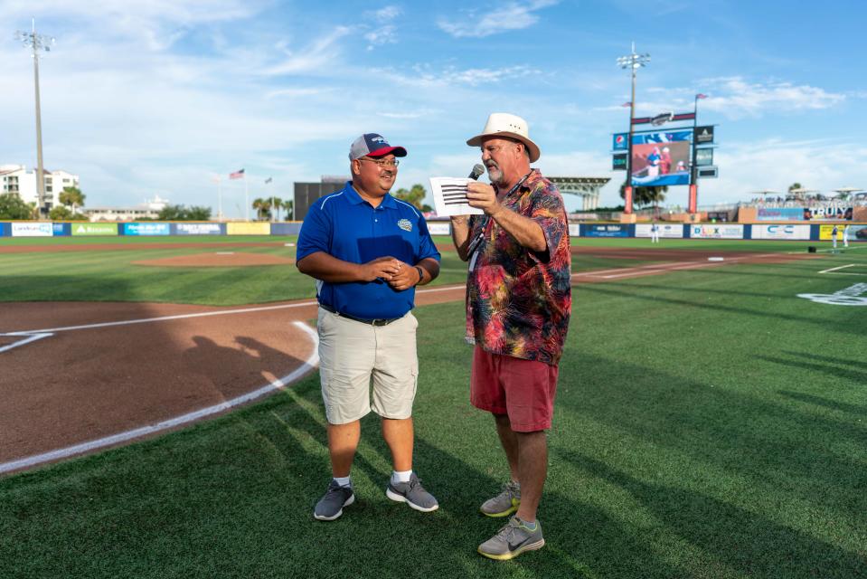 Bill Vikara, a Florida Power and Light technician and youth umpire, talks with Blue Wahoos emcee "Downtown Dave" about working the 75th Little League World Series which begins on Wednesday.