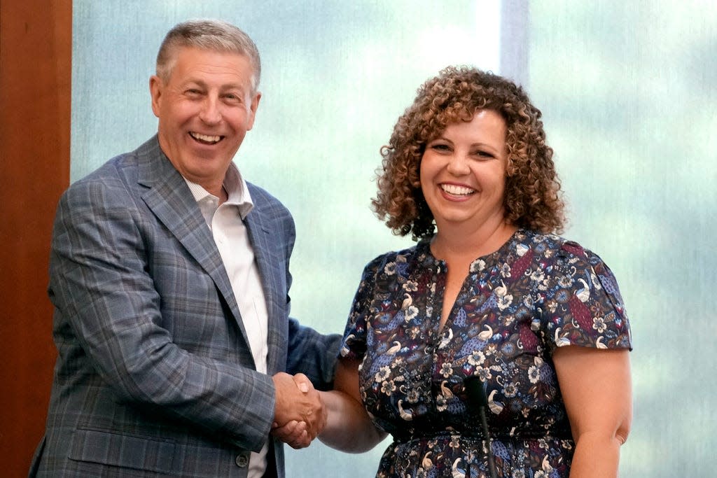 FILE - Bruce Hough and Celeste Maloy shake hands before the start of a 2nd Congressional District Republican primary debate for outgoing Rep. Chris Stewart's seat, Friday, Aug. 4, 2023, in Farmington, Utah. (AP Photo/Rick Bowmer, File)