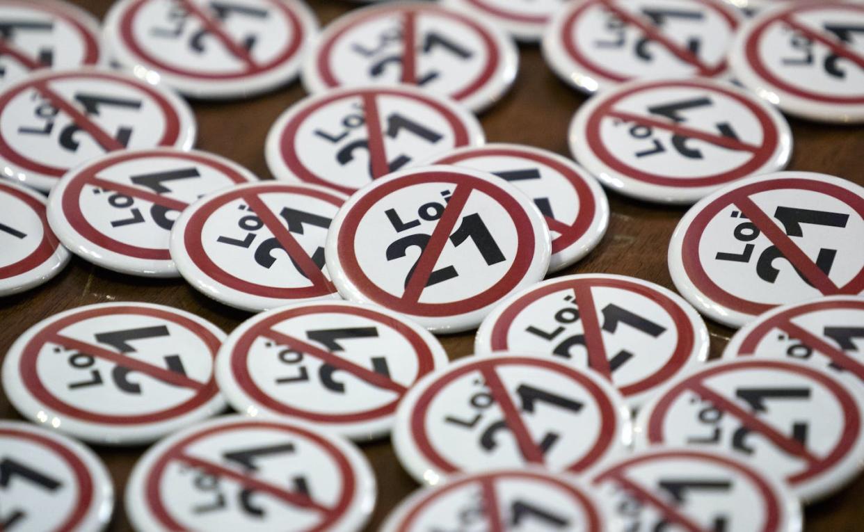Lapel pins are seen as part of a campaign in opposition to Québec's Bill 21 during a news conference in Montréal in September 2019. THE CANADIAN PRESS/Paul Chiasson