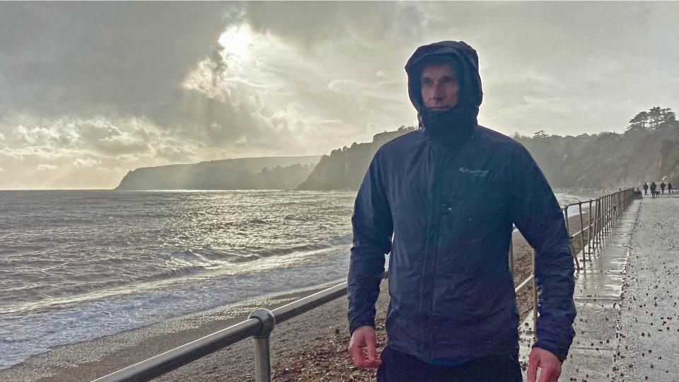 Man wearing Klättermusen Ansur hooded windproof jacket during Storm Ciarán