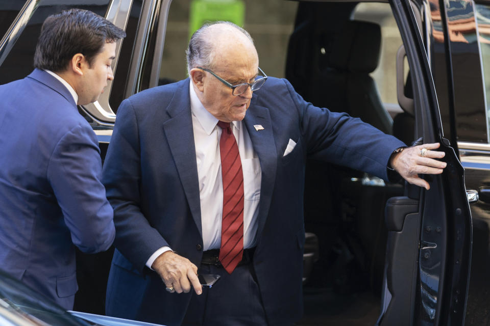 Former Mayor of New York Rudy Giuliani arrives at the federal courthouse in Washington, Monday, Dec. 11, 2023. The trial will determine how much Giuliani will have to pay two Georgia election workers who he falsely accused of fraud while pushing President Donald Trump's baseless claims after he lost the 2020 election. (AP Photo/Jose Luis Magana)