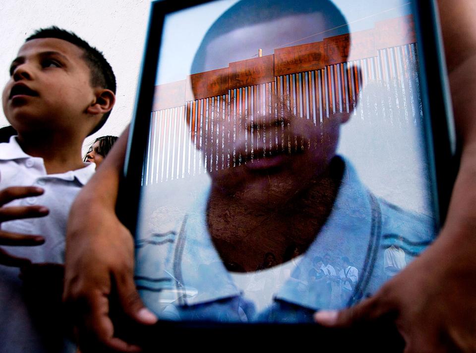 Araceli Rodriguez, mother of Jose Antonio Elena Rodriguez, who was shot to death by the Border Patrol on Oct. 10, 2012, holds a photo of her son in Nogales, Mexico, in 2012.