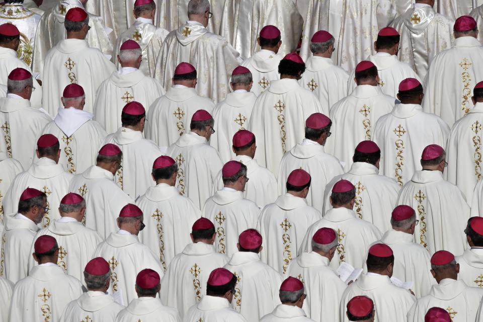 Prelates attend a canonization Mass in St. Peter's Square at the Vatican, Sunday, Oct. 13, 2019. Pope Francis on Sunday canonized Cardinal John Henry Newman, the 19th-century Anglican convert who became an immensely influential, unifying figure in both the Anglican and Catholic churches. Francis presided over Mass on Sunday in a packed St. Peter's Square to declare Newman and four women saints. (AP Photo/Alessandra Tarantino)