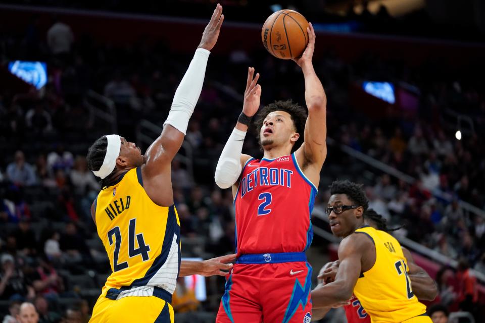 Detroit Pistons guard Cade Cunningham (2) shoots on Indiana Pacers guard Buddy Hield (24) in the first half   Friday, March 4, 2022 in Detroit.