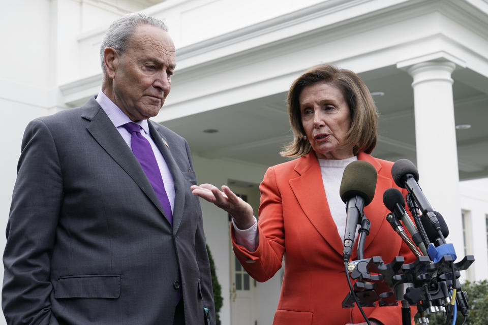 FILE - Senate Majority Leader Chuck Schumer of N.Y., right, listens as House Speaker Nancy Pelosi of Calif., left, speaks to reporters at the White House in Washington, Nov. 29, 2022, about their meeting with President Joe Biden. Congress is moving swiftly to prevent a looming U.S. rail workers strike. Lawmakers are reluctantly intervening in a labor dispute to stop what would surely be a devastating blow to the nation’s economy if the transportation of fuel, food and other critical goods was disrupted (AP Photo/Susan Walsh)