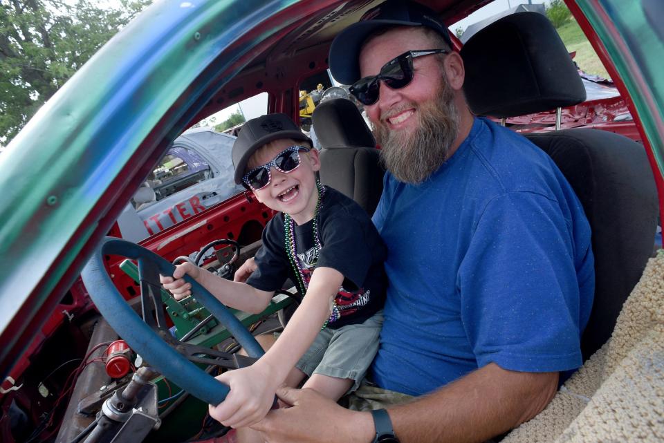 Craig Beaubien and his son Beau, 6, were all smiles behind the wheel of his 2007 Crown Victoria demolition derby car.