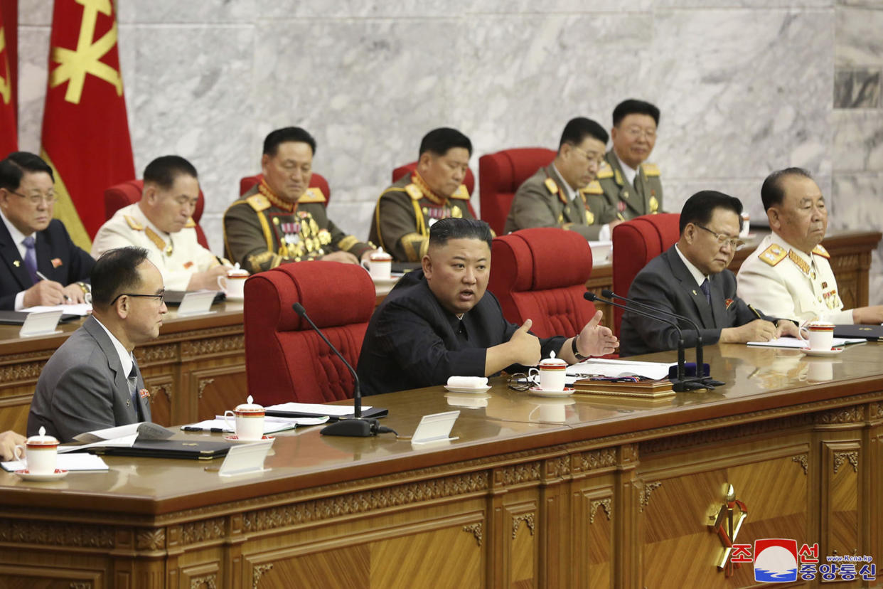 In this photo provided by the North Korean government, North Korean leader Kim Jong Un, center, speaks during a Workers' Party meeting in Pyongyang, North Korea, Thursday, June 17, 2021. Kim ordered his government to be fully prepared for confrontation with the Biden administration, state media reported Friday, June 18, days after the United States and other major powers urged the North to abandon its nuclear program and return to talks. Independent journalists were not given access to cover the event depicted in this image distributed by the North Korean government. The content of this image is as provided and cannot be independently verified. (Korean Central News Agency/Korea News Service via AP)