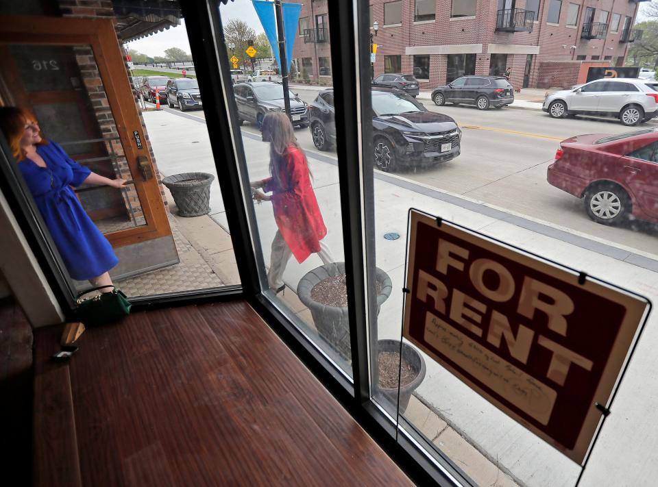 Kim Massey of Wisconsin Women’s Business Initiative Corporation, right, and loan client Angela Green-Ludvik, owner of Nectar Hair Lounge tour her newly leased space on Friday, May 12, 2023. in Menasha, Wis. Wm. Glasheen USA TODAY NETWORK-Wisconsin