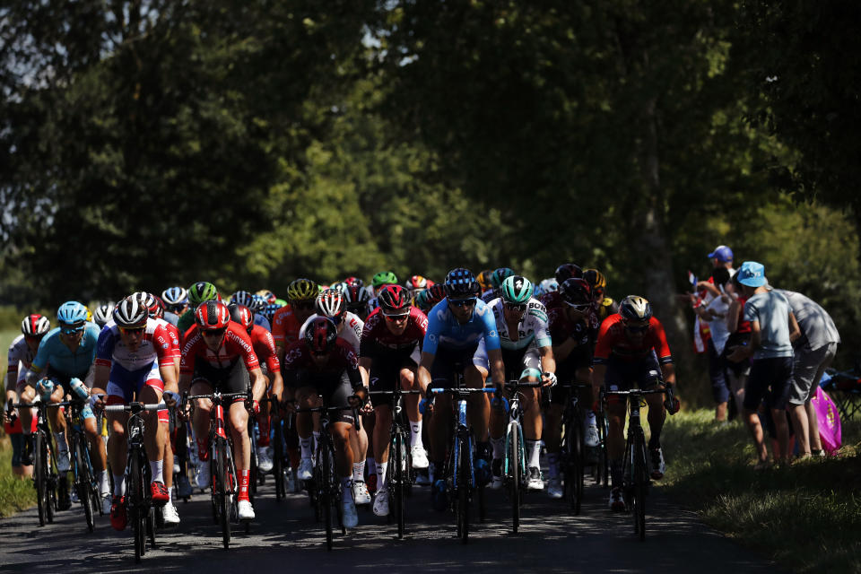 The pack rides during the tenth stage of the Tour de France cycling race over 217 kilometers (135 miles) with start in Saint-Flour and finish in Albi, France, Monday, July 15, 2019. (AP Photo/ Christophe Ena)