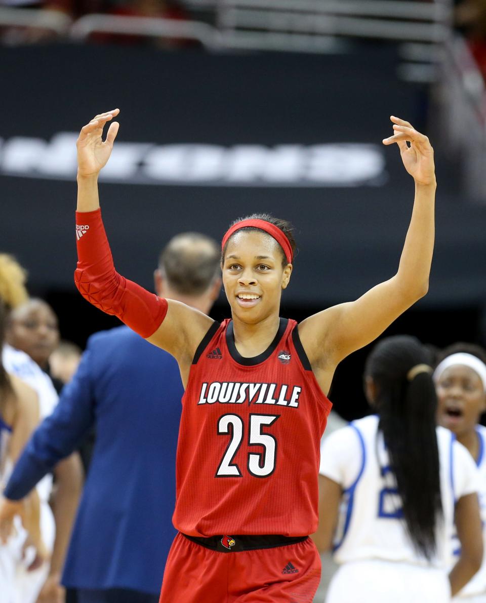 Louisville's Asia Durr pumps up the crowd after Kentucky calls a timeout during a game at the KFC Yum! Center on Dec. 9, 2018. Durr scored a game-high 32 points to lead the Cardinals to an 80-75 victory.