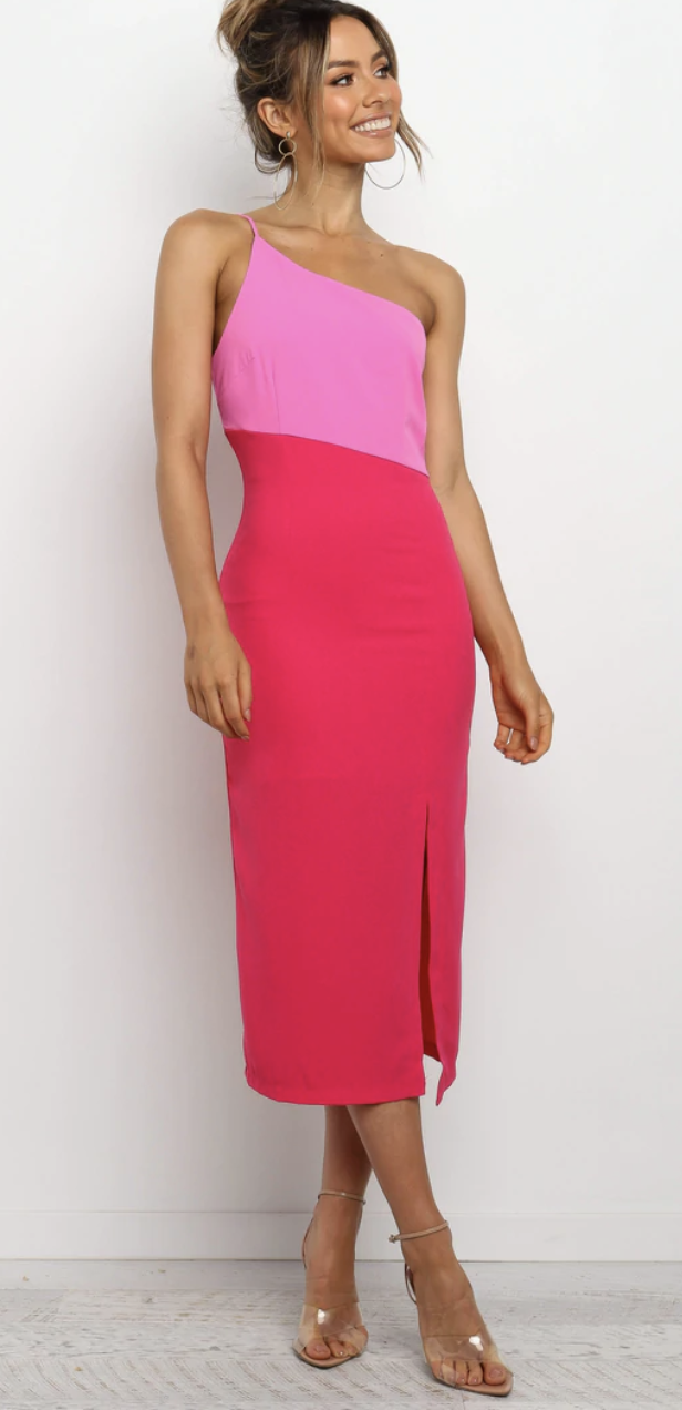 A modeal wears a two-tone pink one shouldered Xiomar Dress, $89, from Petal + Pup