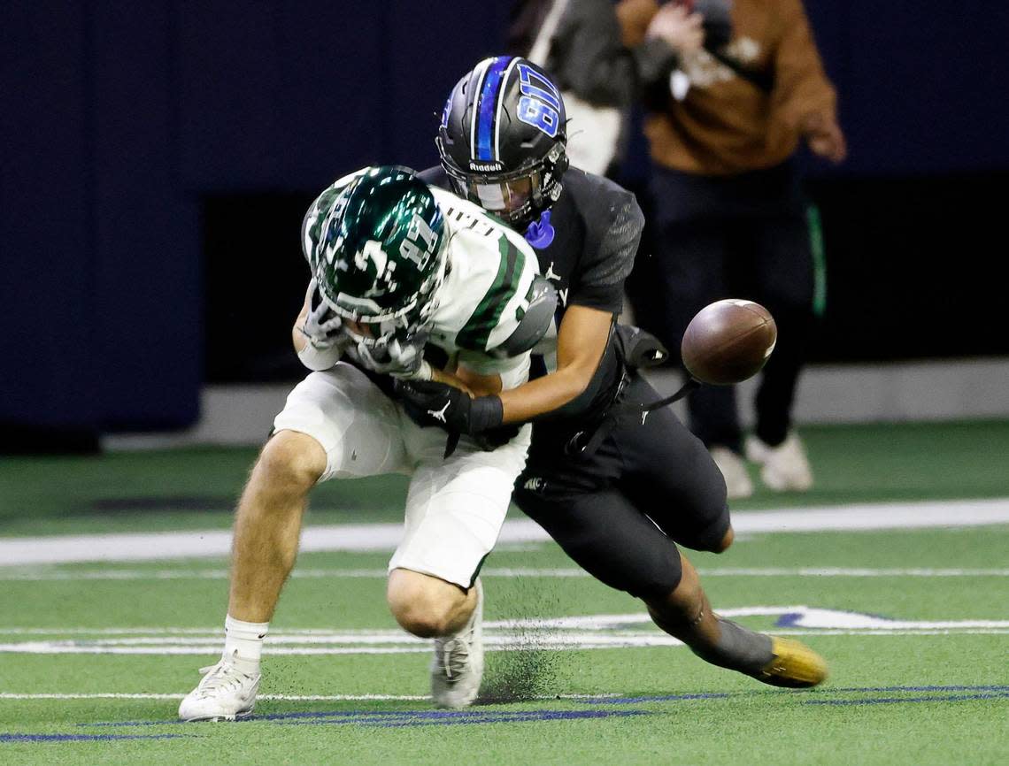 North Crowley linebacker Jonathan Cunningham (14) breaks up a pass intended for Prosper tight end Jack Clifford (17) in the second half of a UIL Class 6A Division 1 football regional-round playoff game at The Ford Center in Frisco, Texas, Saturday, Oct. 25, 2023.
