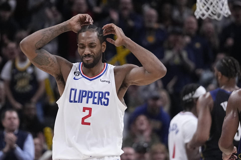 LA Clippers' Kawhi Leonard (2) reacts after Paul George was called for a foul during the second half of an NBA basketball game against the Indiana Pacers, Saturday, Dec. 31, 2022, in Indianapolis. (AP Photo/Darron Cummings)