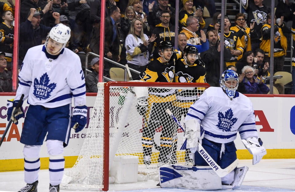 PITTSBURGH, PA - FEBRUARY 18: Pittsburgh Penguins Left Wing Jason Zucker (16) celebrates with Pittsburgh Penguins Center Sidney Crosby (87) after Zucker scored a goal past Toronto Maple Leafs Goalie Frederik Andersen (31) during the second period in the NHL game between the Pittsburgh Penguins and the Toronto Maple Leafs on February 18, 2020, at PPG Paints Arena in Pittsburgh, PA. (Photo by Jeanine Leech/Icon Sportswire via Getty Images)