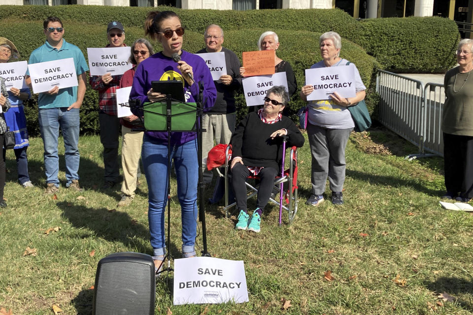 Joselle Torres, with Democracy North Carolina, an election and voter advocacy group, speaks at a news conference outside the Legislative Building in Raleigh, N.C., Tuesday, Oct. 10, 2023. Torres and other speakers urged lawmakers to uphold the vetoes of Democratic Gov. Roy Cooper on several bills. One would shift the power to appoint State Board of Elections members from the governor to legislative leaders, while another would end a three-day grace period to receive and count absentee ballots as long as they are postmarked by Election Day. (AP Photo/Gary D. Robertson)