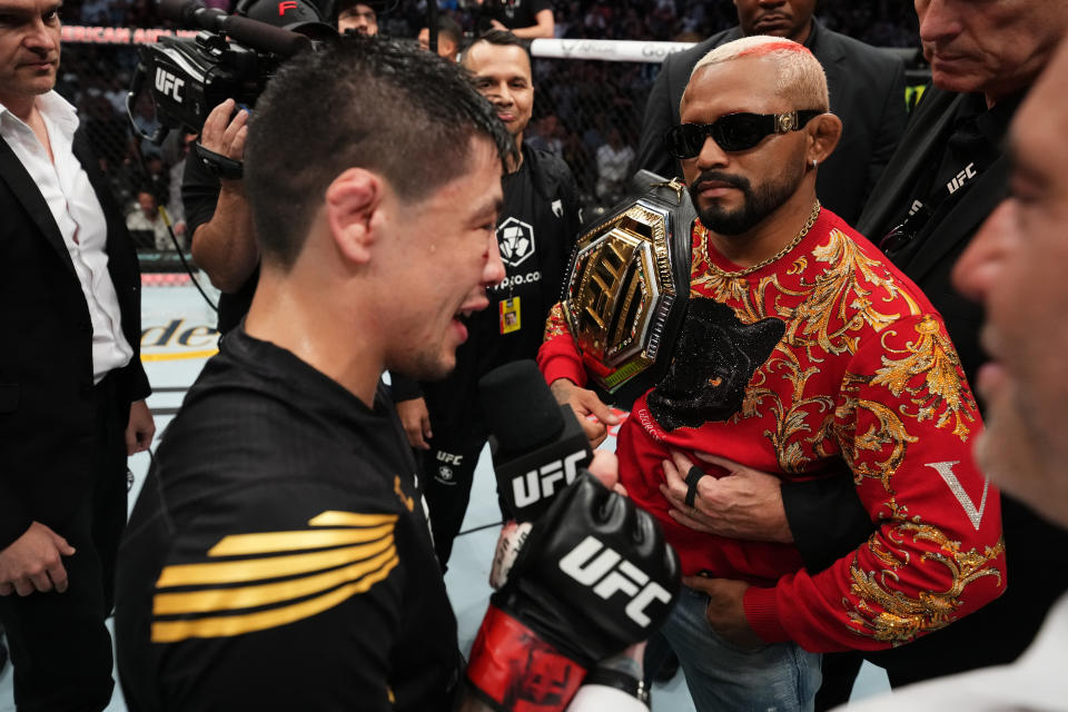 DALLAS, TEXAS - JULY 30: (L-R) Brandon Moreno of Mexico and Deiveson Figueiredo of Brazil interact after Moreno defeated Kai Kara-France of New Zealand in the interim UFC flyweight championship fight during the UFC 277 event at American Airlines Center on July 30, 2022 in Dallas, Texas. (Photo by Josh Hedges/Zuffa LLC)