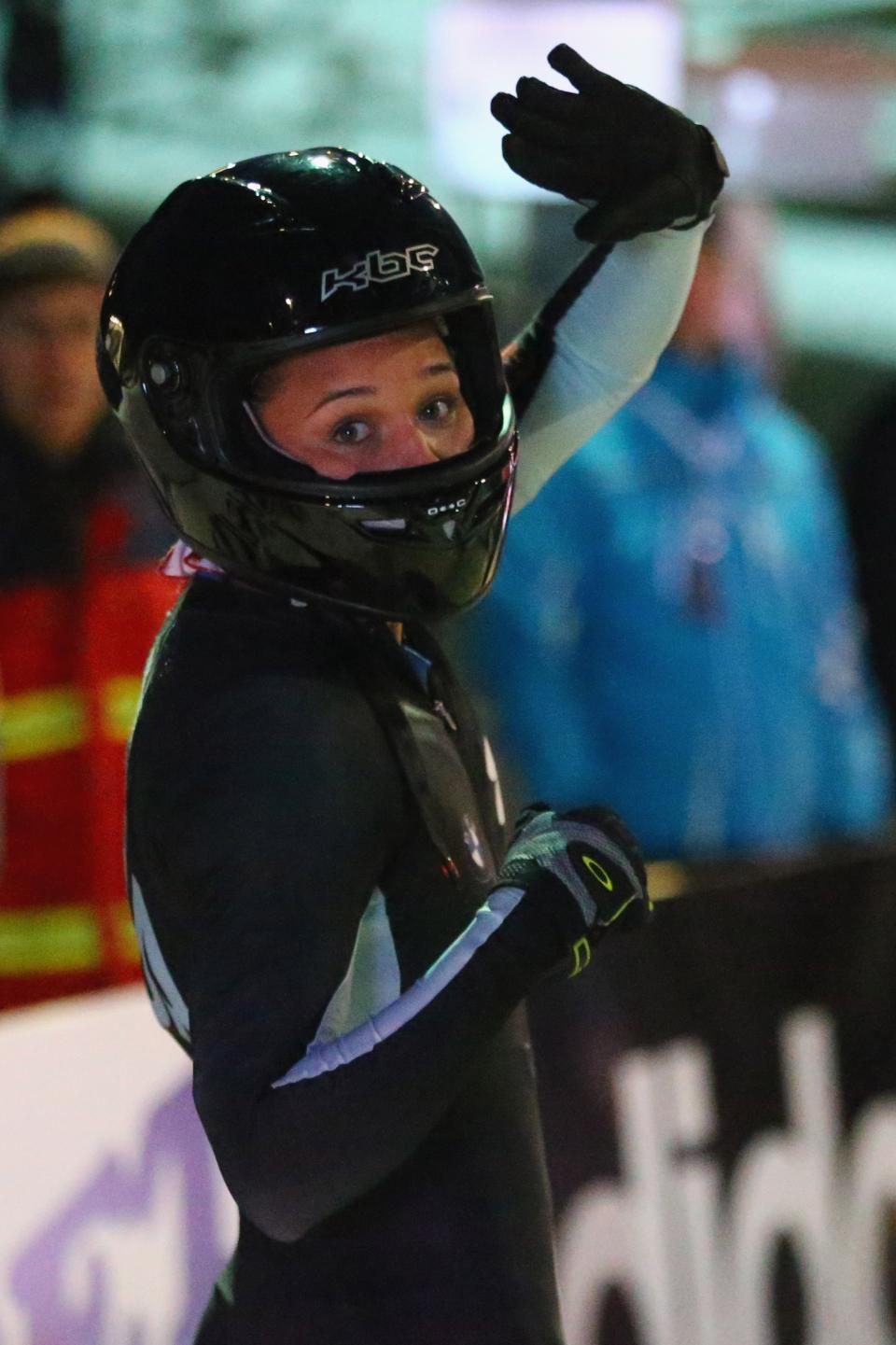 WINTERBERG, GERMANY - DECEMBER 08: Olympic champion Lolo Jones of of United States waves to the crowd during the team competition of the FIBT Bob & Skeleton World Cup at Bobbahn Winterberg on December 8, 2012 in Winterberg, Germany. (Photo by Christof Koepsel/Bongarts/Getty Images)