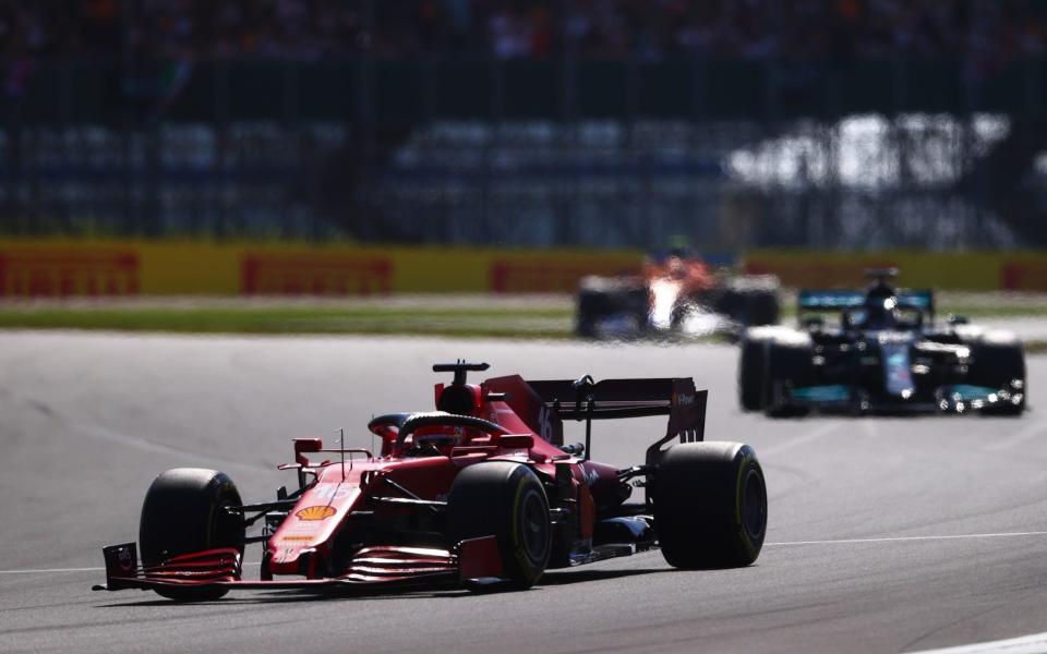 Charles Leclerc of Monaco driving the (16) Scuderia Ferrari SF21 leads Lewis Hamilton of Great Britain driving the (44) Mercedes AMG Petronas F1 Team Mercedes W12 during the F1 Grand Prix of Great Britain at Silverstone on July 18, 2021 in Northampton