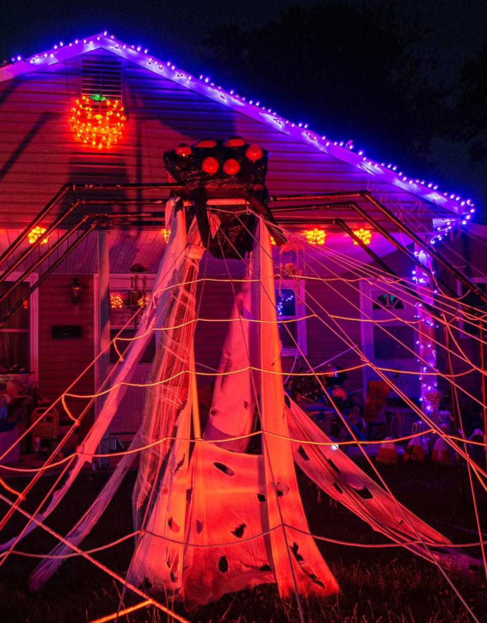 Halloween spider web decorates the front lawn at 100 Blough Road, in Fairless Hills, on Sunday, Oct. 17, 2021. The house is part of he Lower Bucks Drive Thru Halloween House Tour.