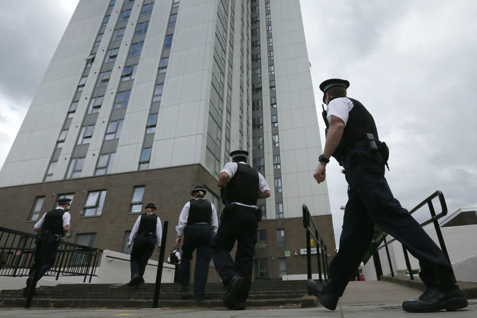 <p>Police officers outside Dorney Tower, part of the Chalcots Estate in the borough of Camden, north London, Sunday June 25, 2017. The apartments were evacuated after fire inspectors concluded that the buildings were unsafe because of problematic fire doors, gas pipe insulation, and external cladding similar to that blamed for the rapid spread of a fire that engulfed Grenfell Tower on June 14. (Photo: Tim Ireland/AP) </p>