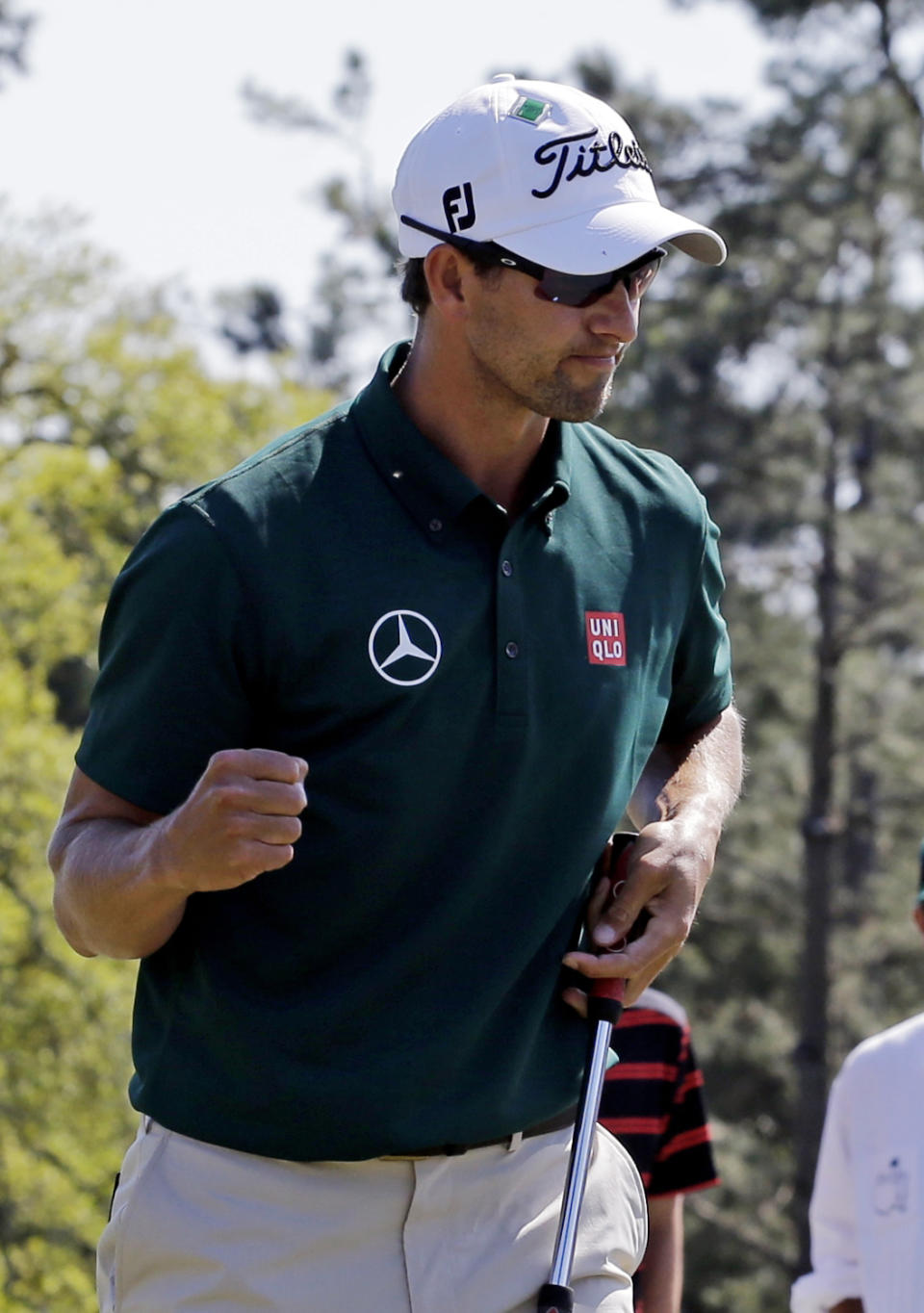 Adam Scott, of Australia, punches the air after making par on the 18th hole during the first round of the Masters golf tournament Thursday, April 10, 2014, in Augusta, Ga. (AP Photo/David J. Phillip)