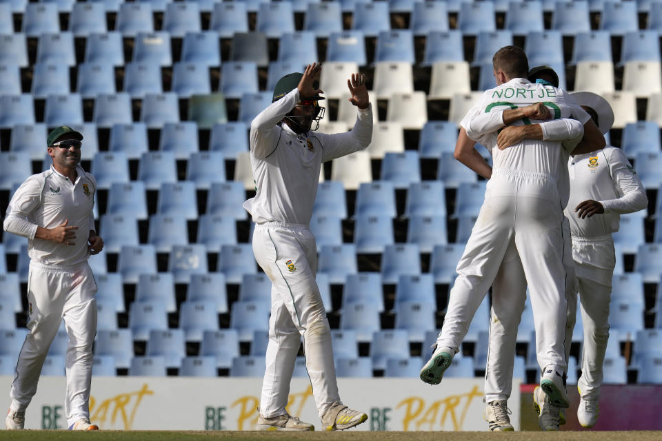 South Africa's bowler Anrich Nortje, right, celebrates with teammates after dismissing West Indies's batsman Kyle Mayers, for 18 runs during the second day of the first test cricket match between South Africa and West Indies, at Centurion Park in Pretoria, South Africa, Wednesday, March 1, 2023. (AP Photo/Themba Hadebe)