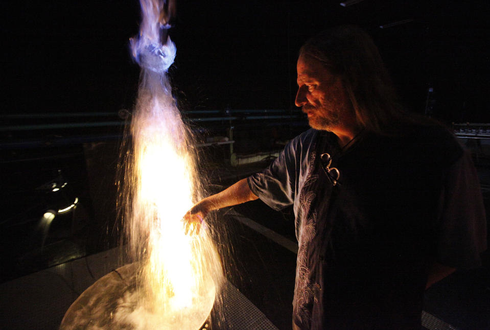 Jim Doyle, right, a water architect at WET Design in Sun Valley puts his arm in a water and fire  treatment that they are testing on June 03, 2013.  Doyle who designs ambitious, high profile water landmarks has created the Mirage volcano in Las Vegas, and a variety of water effects. His next project is a water treatment for Alonzo King LINES ballet's 