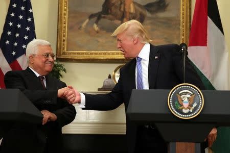 U.S. President Donald Trump shakes hands with Palestinian President Mahmoud Abbas as they deliver a statement at the White House in Washington D.C., U.S., May 3, 2017. REUTERS/Carlos Barria