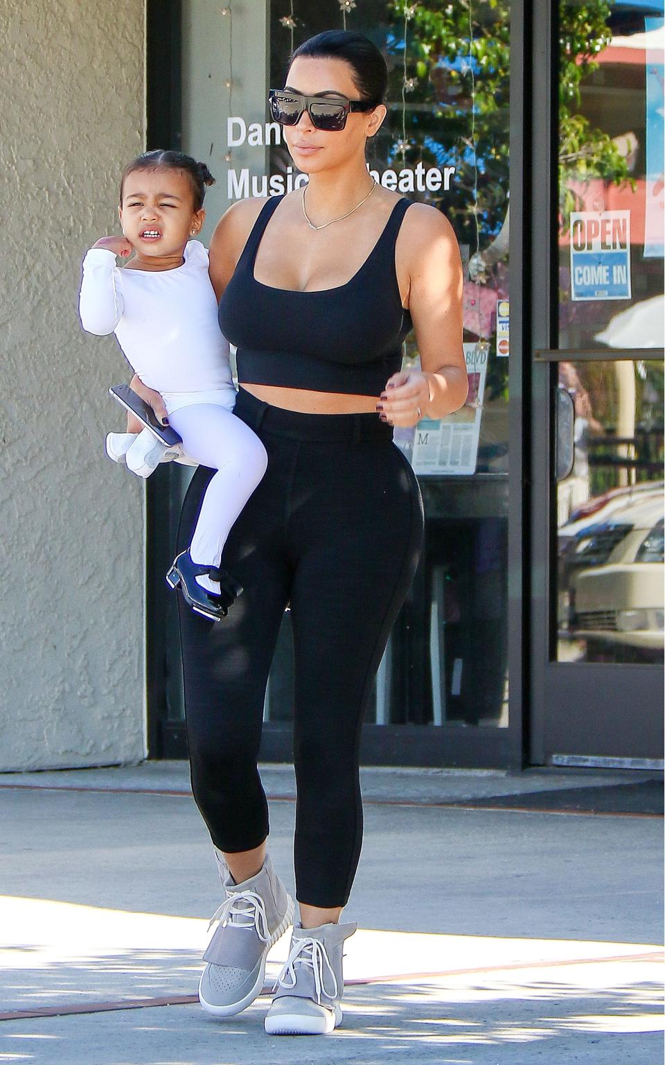 Kim Kardashian with North West - Credit: Rex