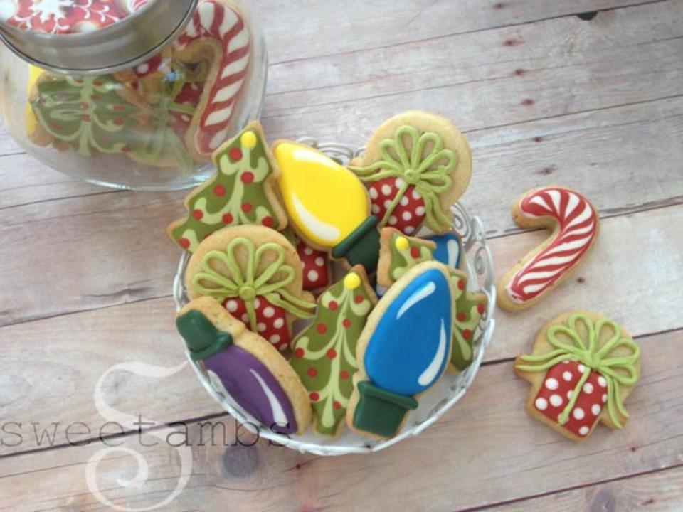 <p>SweetAmbs</p><p>Big Christmas cookie flavor in sweet little bites.</p><p><strong>Get the recipe: <a href="https://www.sweetambs.com/tutorial/how-to-decorate-mini-christmas-cookies/" rel="nofollow noopener" target="_blank" data-ylk="slk:Mini Christmas Cookies;elm:context_link;itc:0;sec:content-canvas" class="link ">Mini Christmas Cookies</a></strong></p>