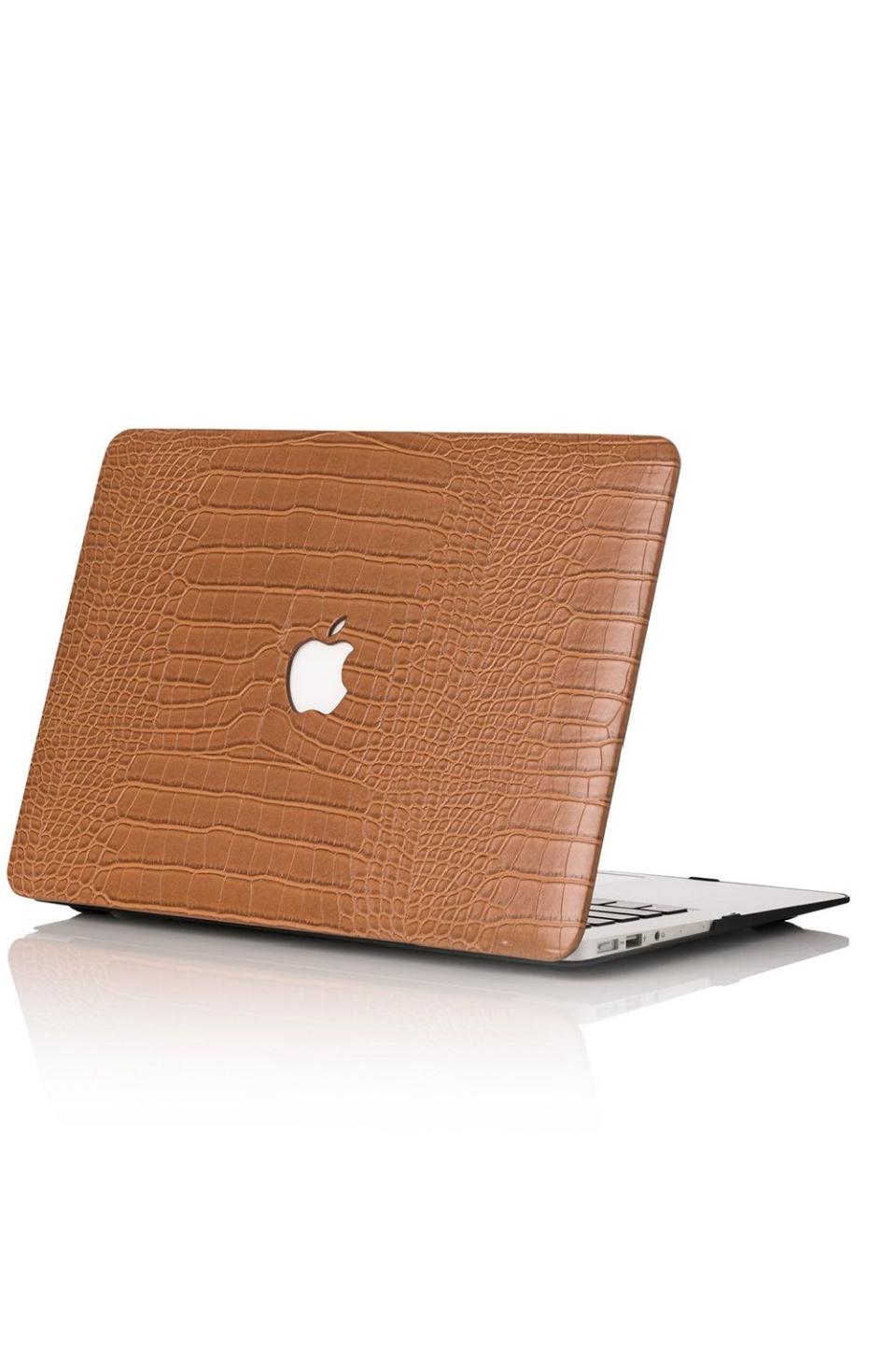 <p><a href="https://chicgeeks.com/collections/macbook-cases/products/caramel-faux-crocodile-macbook-case" rel="nofollow noopener" target="_blank" data-ylk="slk:Shop Now;elm:context_link;itc:0;sec:content-canvas" class="link ">Shop Now</a></p><p>Caramel Faux Crocodile MacBook Case</p><p>chicgeeks.com</p><p>$76.00</p><span class="copyright">Chic Geeks</span>