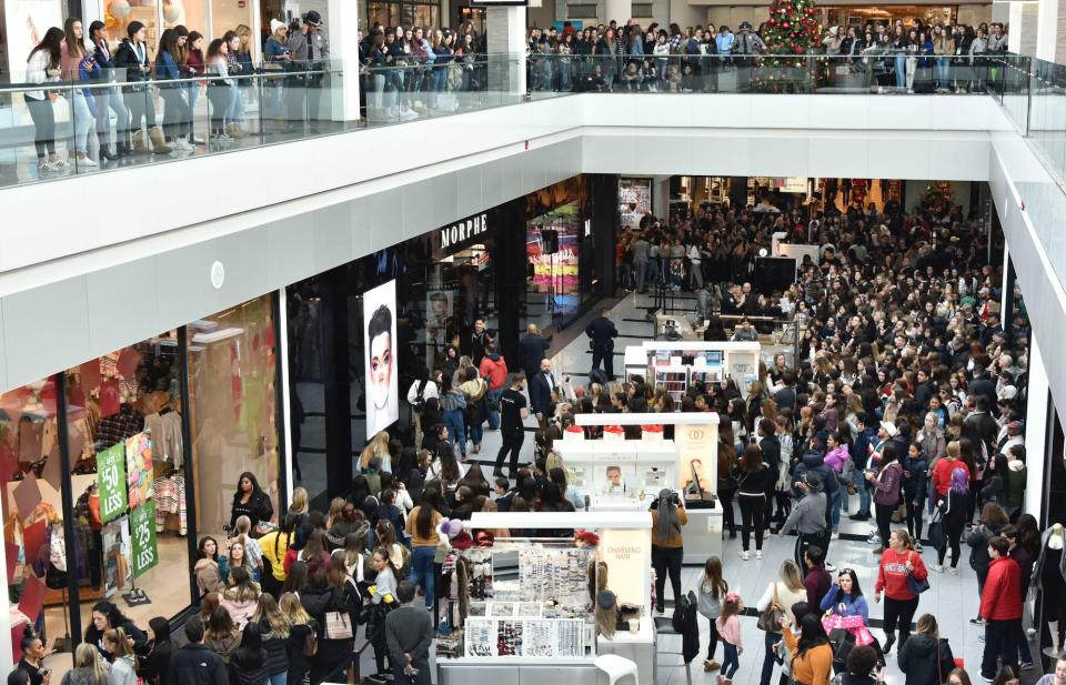 Beauty fans gather outside a Morphe store grand opening on December 1, 2018.