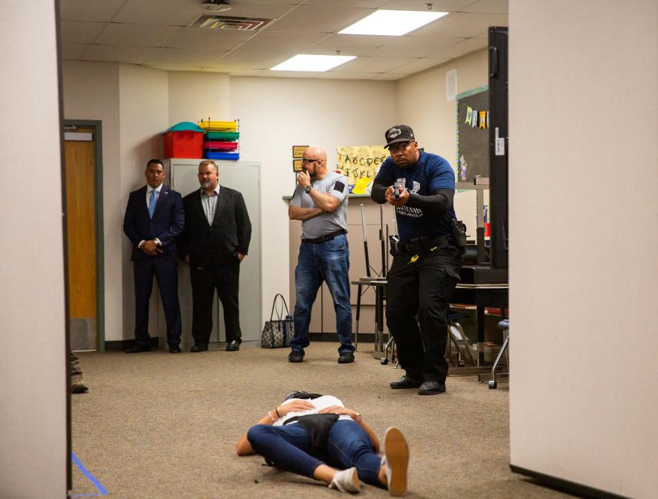 An El Mirage school resource officer participates in an active shooter training exercise inside a classroom at West Point Elementary School in Surprise on June 21, 2023.