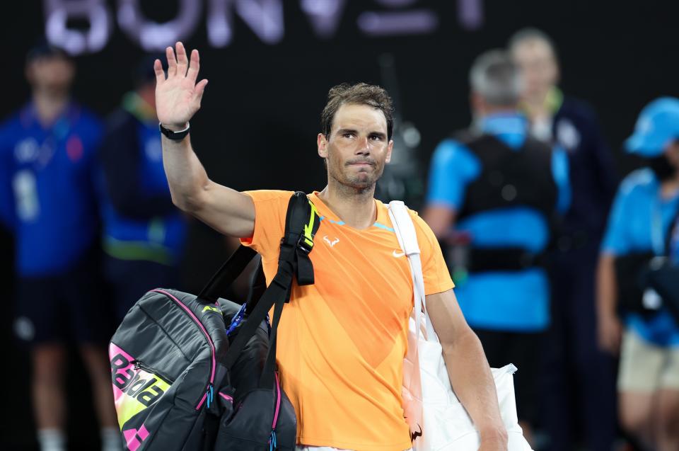 Rafael Nadal waves to the crowd at the Australian Open.