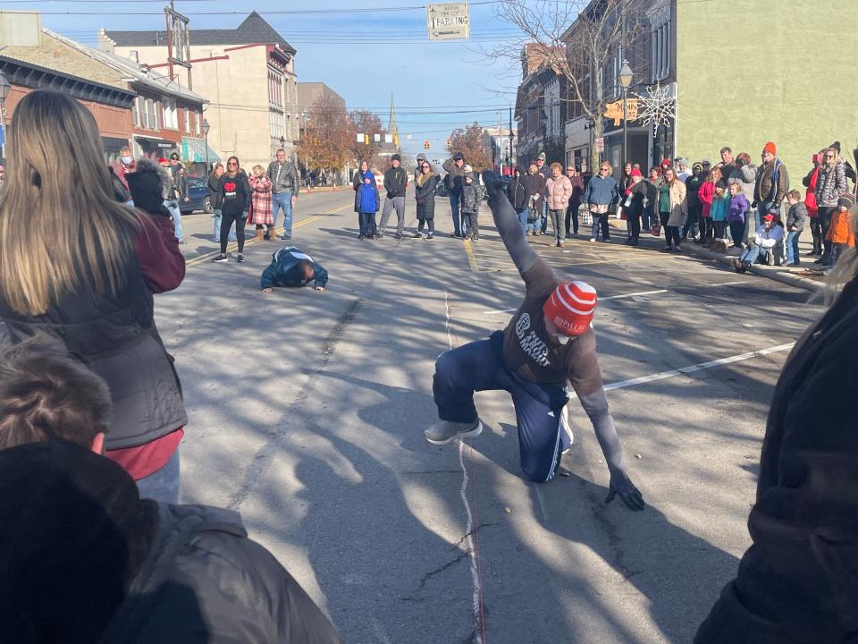 Daniel Bradshaw throws his hand up in celebration after he was the first to get his peanut across the finish line in the final race for the WMRN Peanut Push on Dec. 4, 2021.