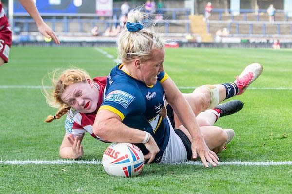 Amy Hardcastle scores for Rhinos against Wigan. Picture by Allan McKenzie/SWpix.com.
