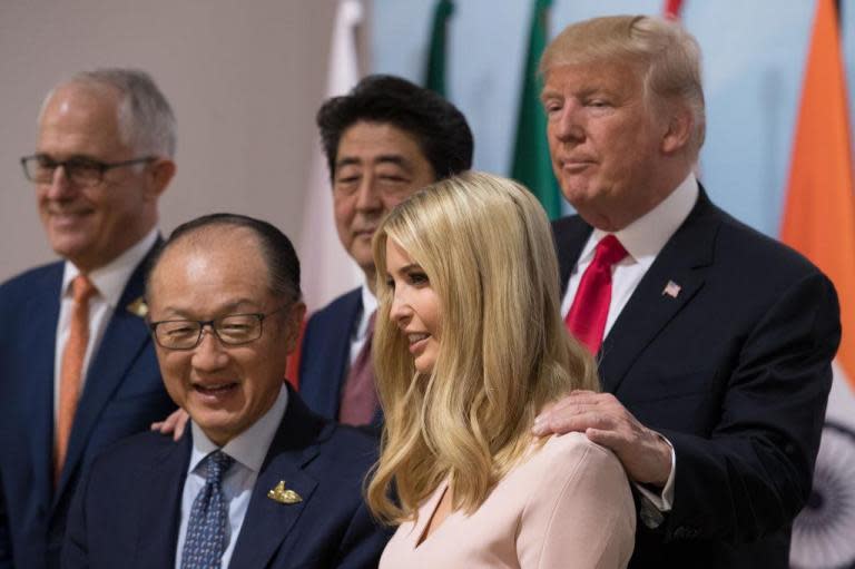 Donald Trump justifies putting Ivanka at G20 table after wave of criticism and insists Angela Merkel 'agrees'