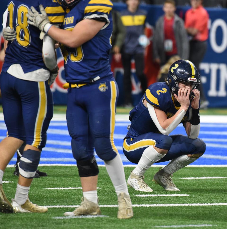 Senior Ryin Ruddy hands onto his face, squats down as the Whiteford Bobcats came up short losing to Ubly 21-6 in the Division 8 State Finals 21-6 at Ford Field Saturday, November 25, 2023.
