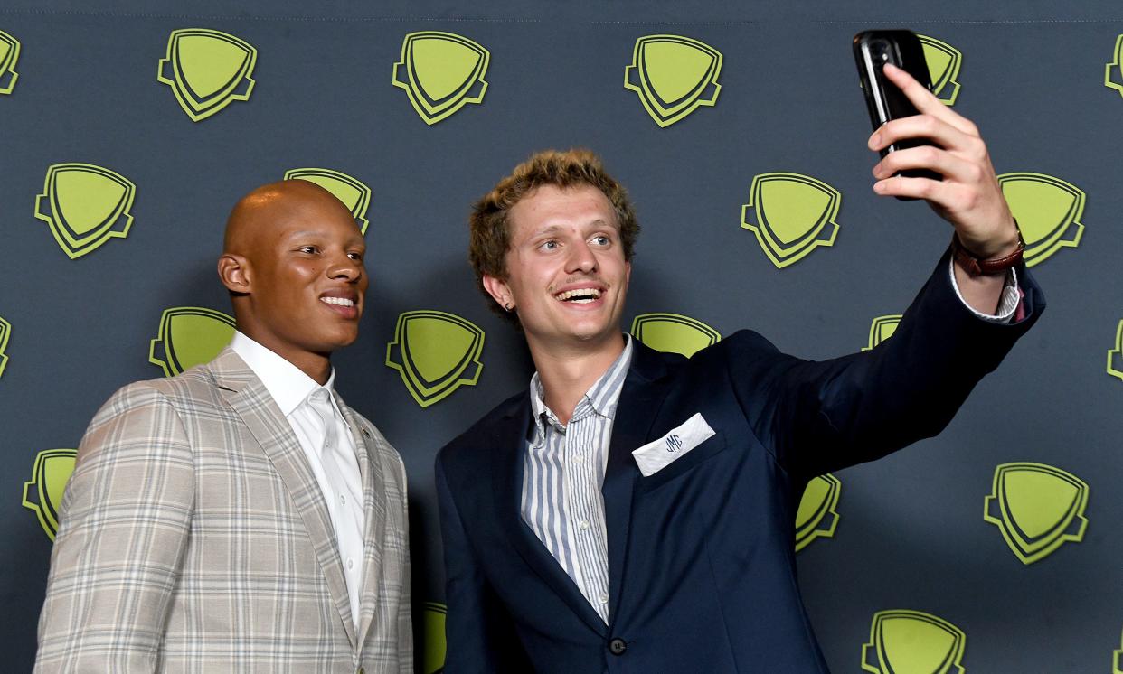 Jonny Marshall takes a selfie with NFL quarterback Joshua Dobb during the 2023 Greater Akron-Canton High School Sports Awards at the Akron Civic Theatre, where he was honored as the Boys Swimmer of the Year.