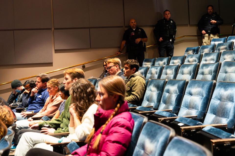 Police stand in the back while attendees listen at an event put on by student group Young Americans for Freedom featuring Chloe Cole at the University of Utah in Salt Lake City on Thursday, Nov. 30, 2023. Cole previously identified as transgender and received medical interventions but has since “detransitioned” to the gender she was assigned at birth. | Megan Nielsen, Deseret News